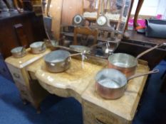 A SET OF FIVE GRADUATED COPPER SAUCEPANS