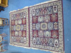 A PAIR OF MAROON AND BLUE GROUND RUGS, 100% worsted acrylic yarn 'Carmel Carpets at Debenhams