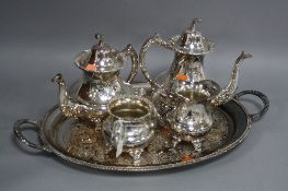 A MODERN SILVER PLATED FOUR PIECE TEA SET, on an oval twin handled tray (5)