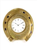 A French mantel timepiece of horseshoe form, circular white enamel dial signed Henry Bright,