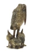 An Austrian cold painted bronze model of a stork, with her five chicks, late 19th century / early