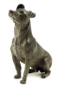 An Austrian cold painted bronze model of a seated dog, stamped `GESCHUTZT`, late 19th century, 11.
