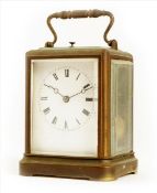 A carriage clock in one piece case, white enamel dial, repeating movement bearing the circular stamp