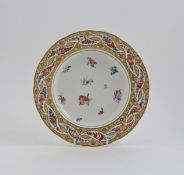A SÃ¨vres soup plate from the Duc d`Aiguillon service, c.1779, painted with scattered polychrome