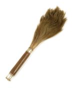 A late 19th century fly whisk, with a leather and white metal mounted handle, with initials 'S. G.