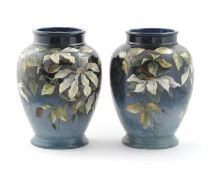 A pair of Doulton Lambeth Impasto vases by Kate Rogers, dated 1881, shouldered form, painted with