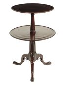 A mahogany dumb waiter, with two dished tiers on a turned stem and tripod supports with scroll