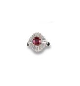 A ballerina style ruby and diamond set cluster ring, the circular cut ruby weighs approximately 1.