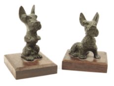? Two late 19th century bronze models of Scottie dogs, each on a rosewood plinth, 6cm high, max. (