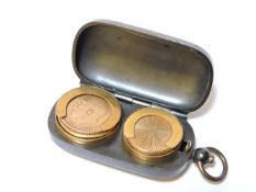 A George V gold sovereign 1911, within a gunmetal sovereign case with gilt interior