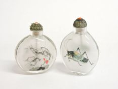 Two Chinese opaque inside-painted glass snuff bottles and stoppers, one decorated with crickets, the