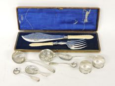 A pair of Victorian silver napkin rings, spoons, etc, together with silver plated fish servers