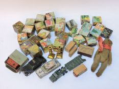 A small toy bear, two 'Jack in a Box' match boxes, and two nursery block puzzles