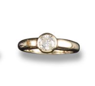 A diamond solitaire ring, the circular cut diamond weighs approximately 0.45cts and is rub-over