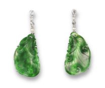A pair of jade seed pearl and diamond drop earrings, the carved jade sections suspend from a white