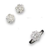 A diamond cluster ring, the circular cut diamond is set within a surround of smaller circular cut