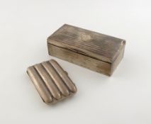 A silver cigar case, by Charles Green and Co, Birmingham 1918, rectangular form, modelled to fit