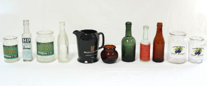 A green-tinted glass bottle “W. H. MALLETT & Co., TRURO”, 7½