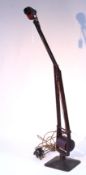 A 1940s Hadrill & Horstmann “Roller” counterpoise desk lamp (crimson).