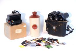 A pair of Swift “Saratoga MK II” 8 x 40mm field glasses, with case; a stoneware footwarmer; a