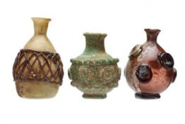 THREE UMAYYAD OR EASTERN IRANIAN GLASS FLASKS, each having applied decoration and bearing previous