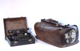 A tan leather Gladstone-type bag.