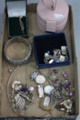 A TRAY OF SILVER AND COSTUME JEWELLERY