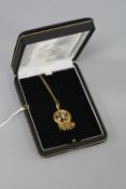A LATE VICTORIAN ROLLED GOLD SPLIT PEARL MEMORIAL PENDANT, a round shape pendant, rope edge border