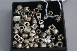 A BOX OF MIXED SILVER CHARMS