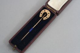 A 9CT VICTORIAN HORSESHOE STICK PIN, set with diamonds (original box)