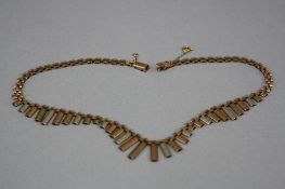 A LATE 20TH CENTURY 9CT GOLD CLEOPATRA STYLE NECKLACE, variable three colour satin finish links,