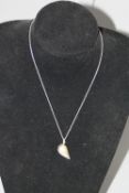 A GEORG JENSEN SILVER NECKLACE AND LOCKET