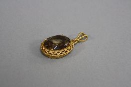 A MODERN LARGE SMOKY QUARTZ PENDANT, an oval mixed cut smoky quartz measuring approximately 19.8mm x