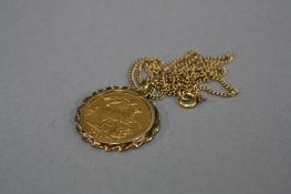 A SOVEREIGN PENDANT AND CHAIN, twist wire design pendant mount, George V full sovereign dated