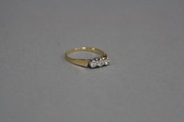 AN 18CT THREE STONE DIAMOND RING, ring size N1/2