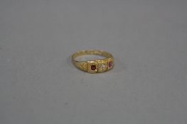 A LATE VICTORIAN 18CT GOLD RUBY AND DIAMOND RING, two oval mixed cut rubies measuring