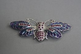 A SILVER PLAQUE DE JOUR BROOCH