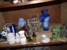 A vintage green enameled mincer, a glass and basket ware wine cooler, vases, candlesticks,