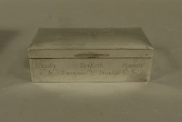 A silver cigarette box engraved with presentation inscription and names, marks rubbed c.