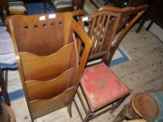 An Arts and Crafts mahogany magazine rack with boxwood stringing and rectangular side panels with