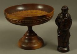 A resin figure of a monk together with a Greek wood pedestal dish