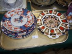A Royal Crown Derby octagonal plate decorated in typical Japan palette together with two Imari