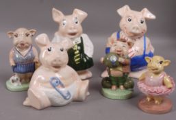 Three Manor pottery pig figures and three other pottery pig figures