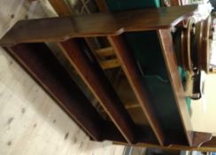 A set of oak open shelves of graduated depth