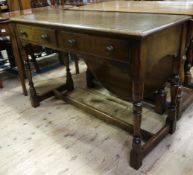 An oak side table ensuite with preceding lot having two drawers to the apron on square framing