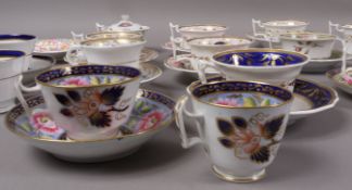 A group of English porcelain cups and saucers and trios, mainly of London style,