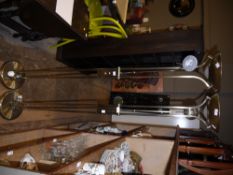 A pair of pale gilt metal uplighters