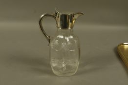 A late Victorian silver mounted cut glass claret jug by Walker and Hall,