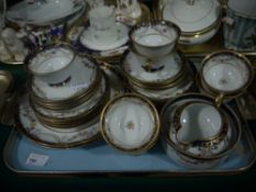 A Noritake china tea service banded in a blue and gilt and floral garlands