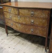 A mahogany serpentine fronted chest of four graduated drawers with cast ring handles together with
